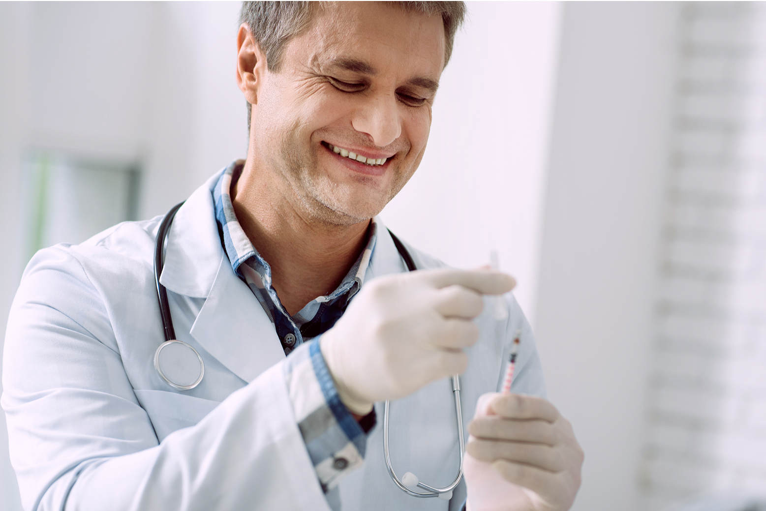 Smiling male doctor with a stethoscope